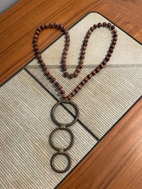 Women’s Brown Bead Necklace with Triple Ring Pendant